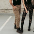 Women legs wearing beige and camo motorcycle cargo pants Lara from moto Girl 