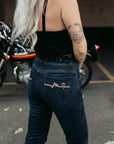 A bottom of a woman wearing high waist lady motorcycle jeans