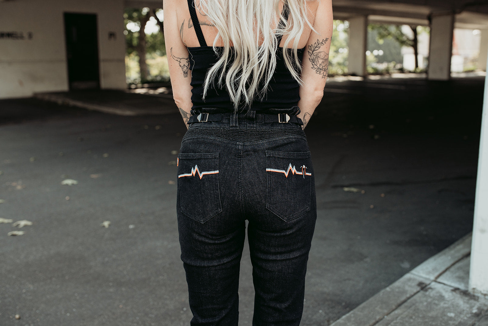 A bottom of a woman wearing high waist lady motorcycle jeans