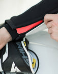 A close up of a zipper on Women's racing suit MIURA RS in black, white and fluo from Shima 