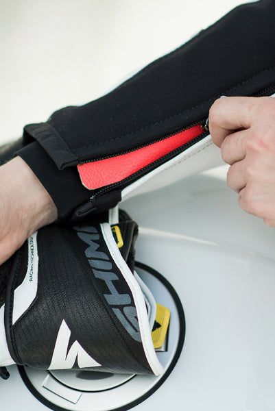 A close up of a zipper on Women's racing suit MIURA RS in black, white and fluo from Shima 