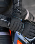 woman's hands on the gas tank wearing Black women motorcycle gloves oslo waterproof from shima