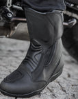 Woman's foot with a black women's motorcycle touring boot from Shima