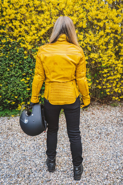Woman's back wearing yellow women's motorcycle jacket