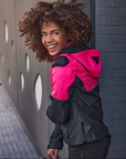 A smiling woman wearing pink DRIFT  motorcycle jacket from Shima