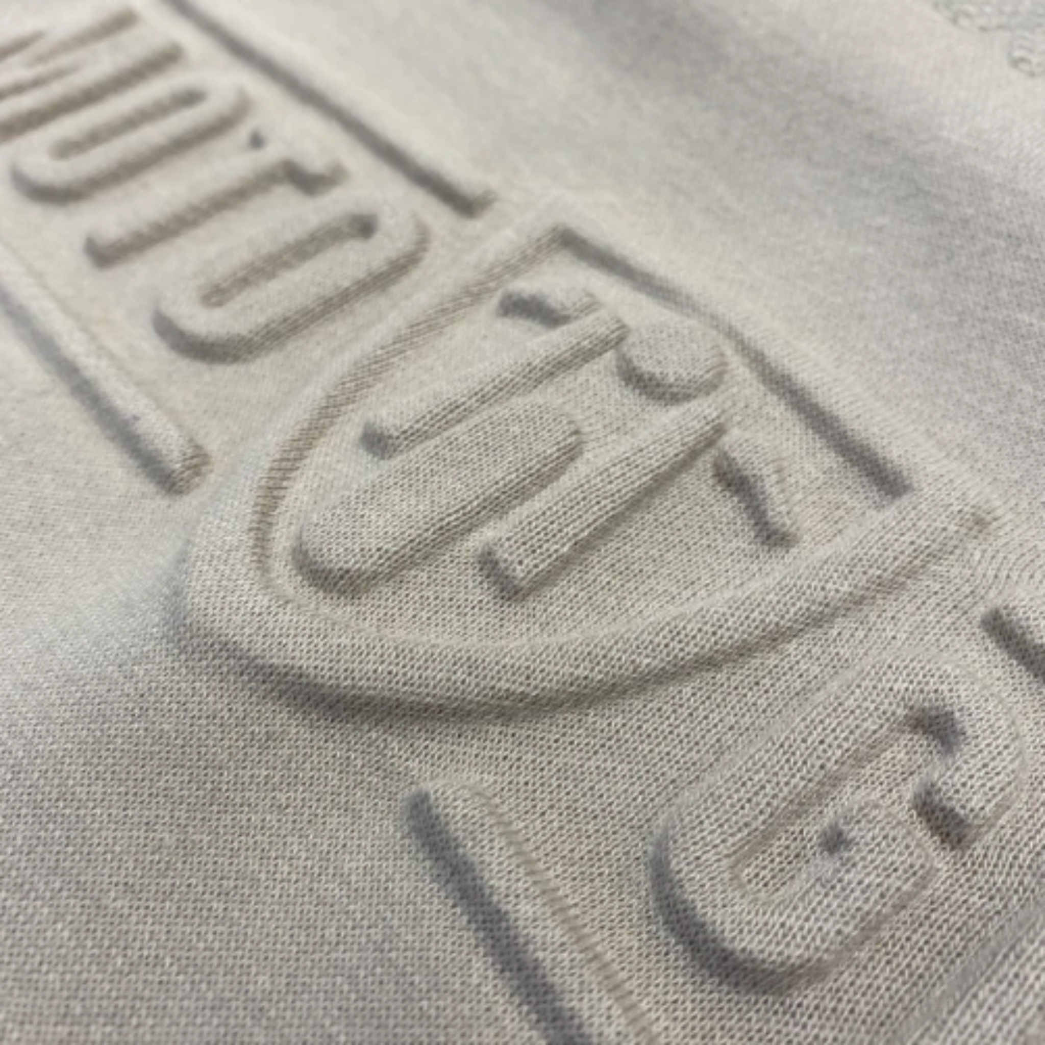 A close up of the Moto girl 3D logo on a sand colour motorcycle lady sweatshirt 