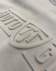 A close up of the Moto girl 3D logo on a sand colour motorcycle lady sweatshirt 