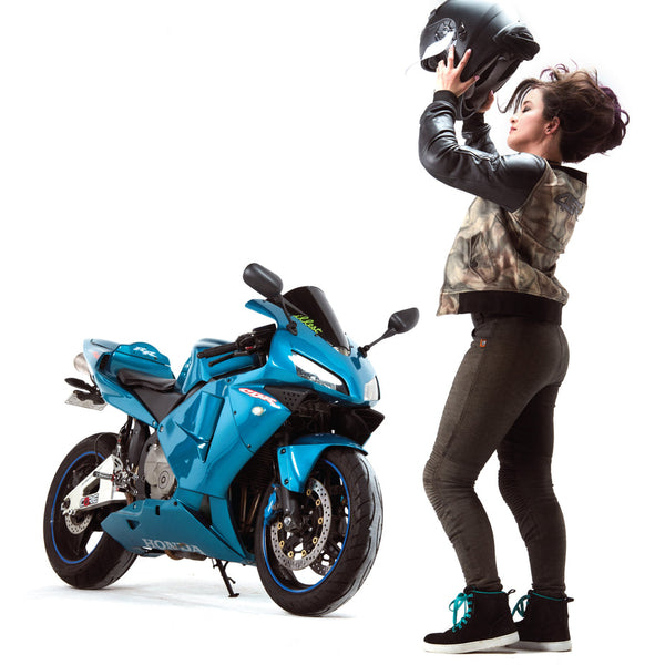 A woman taking off the helmet