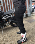 Legs of a woman wearing black Melissa motorcycle jeggings from Moto Girl
