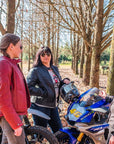 Women enjoying a break during a motorcycle trip wearing motorcycle leather Valerie  jacket from Moto Girl