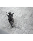 A motorcyclist wearing black motorcycle backpack AYRO from SHIMA