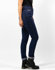 Woman's legs from the side wearing dark blue high waisted women's motorcycle jeans from JohnDoe