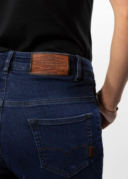 A close up of the back of Woman's legs wearing dark blue high waisted women's motorcycle jeans from JohnDoe