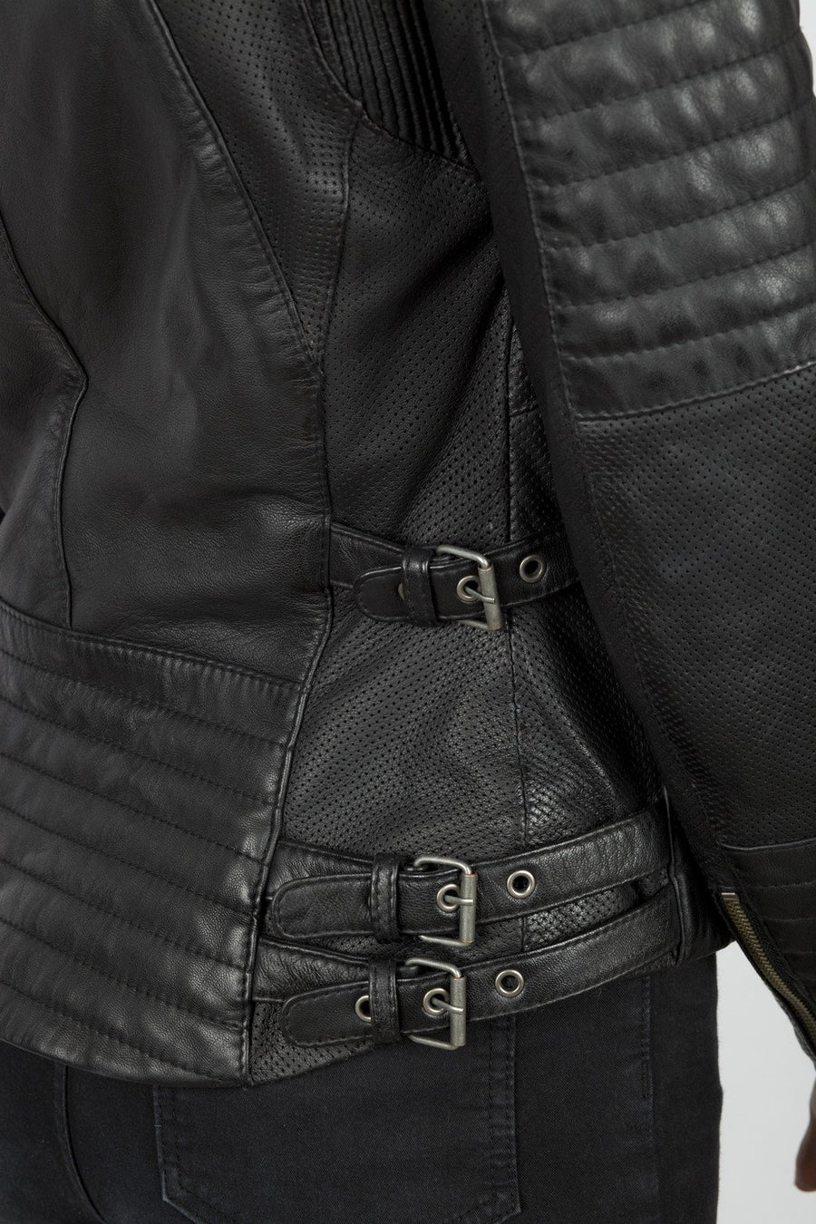 Waist adjustment stripes of the Women&#39;s black leather motorcycle jacket modern classic style from Black arrow label