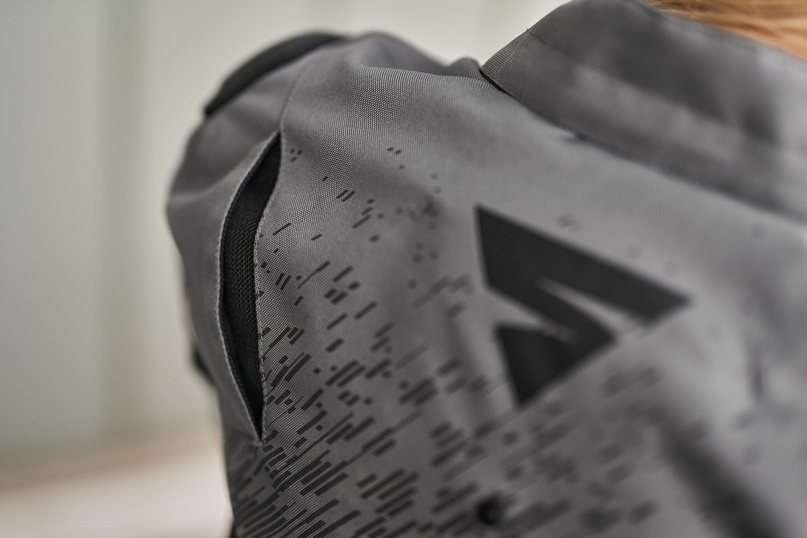 A close up of the ventilation panels on the grey women's motorcycle jacket from SHIMA