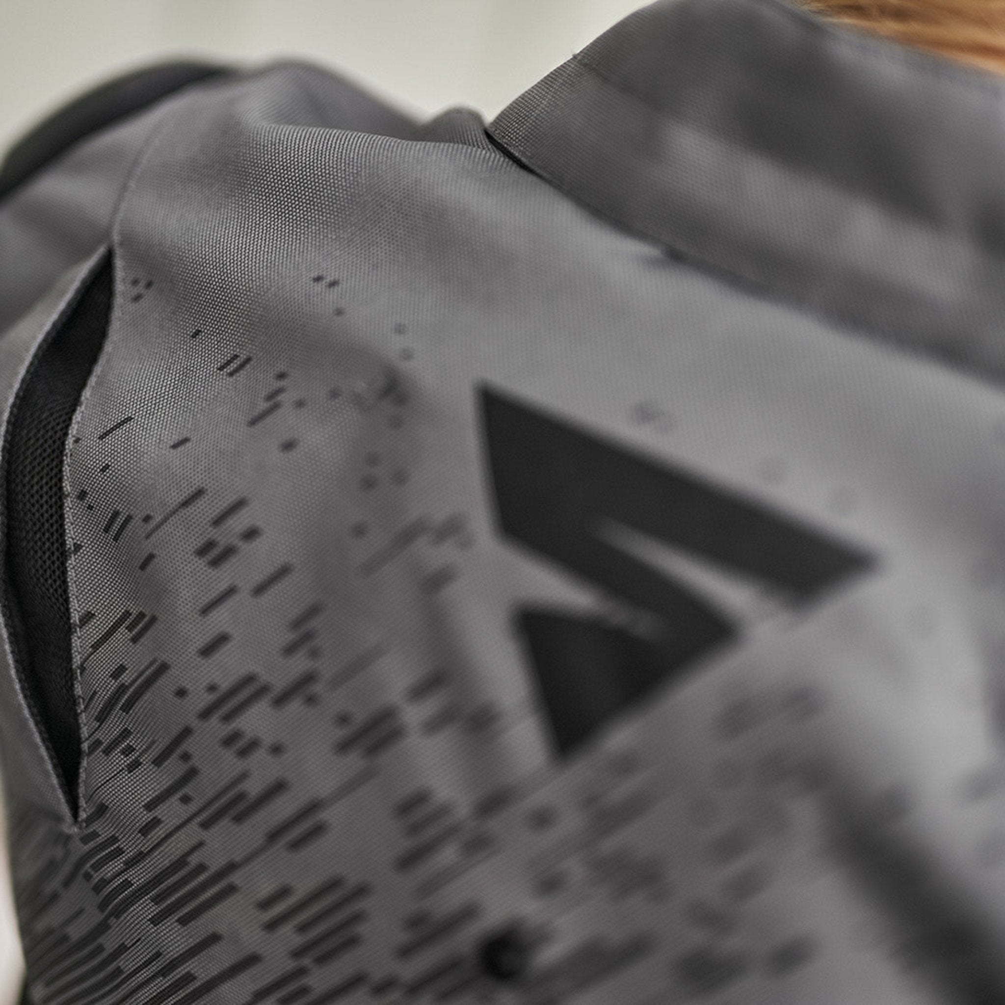 A close up of the ventilation panels on the grey women's motorcycle jacket from SHIMA