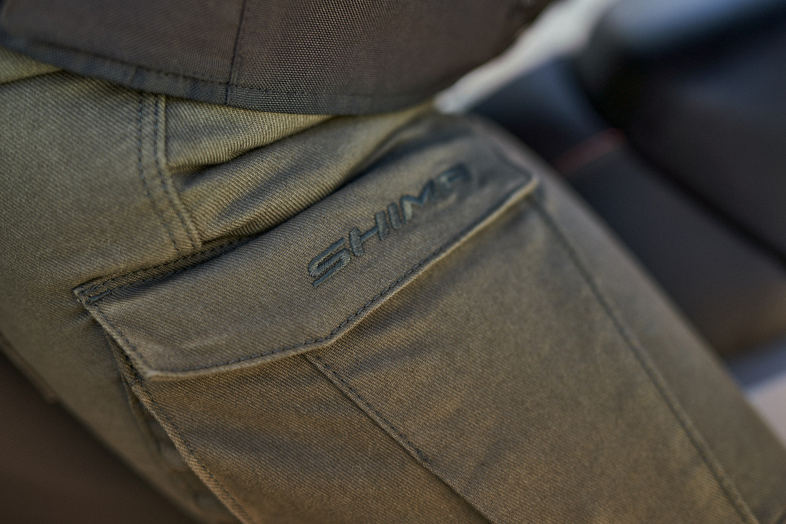 A close up of the pocket of Khaki green women&#39;s motorcycle cargo pants GIRO from shima