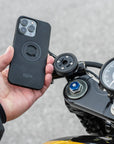 A phone ready to be mounted on a motorcycle handlebar
