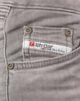 A close up of the John Doe logo on the light grey women's motorcycle jeans 