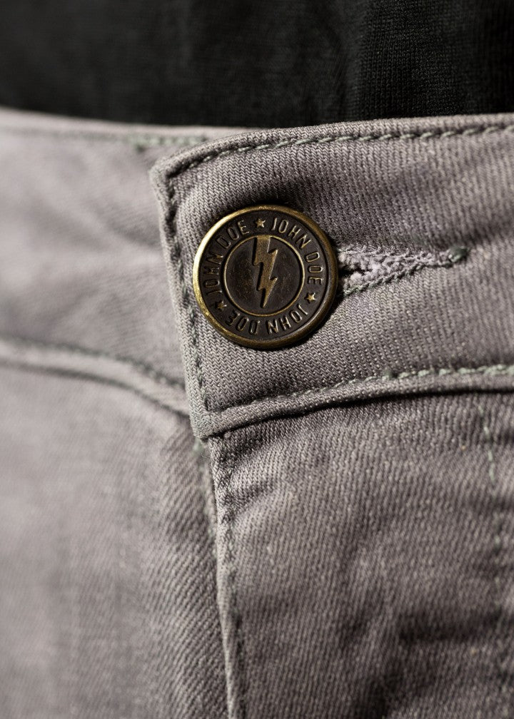 A close up of the jeans button on the light grey women&#39;s motorcycle jeans from John Doe