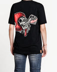 A woman wearing black Pando Moto women's motorcycle t-shirt with red scull motive