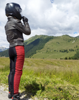 A woman wearing black and red women's motorcycle leggings from exagon66