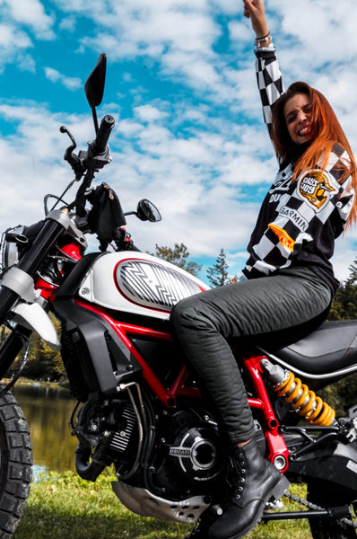 A woman on a motorcycle wearing black women's motorcycle leggings from exagon66