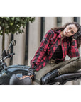 A women siting on a motorcycle and wearing Thomason black motorcycle boots from Shima