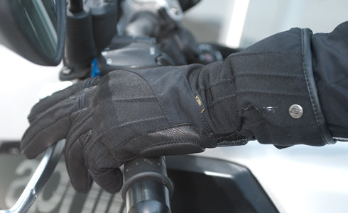 A woman&#39;s hand wearing Black long waterproof women&#39;s motorcycle glove