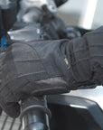 A woman's hand wearing Black long waterproof women's motorcycle glove